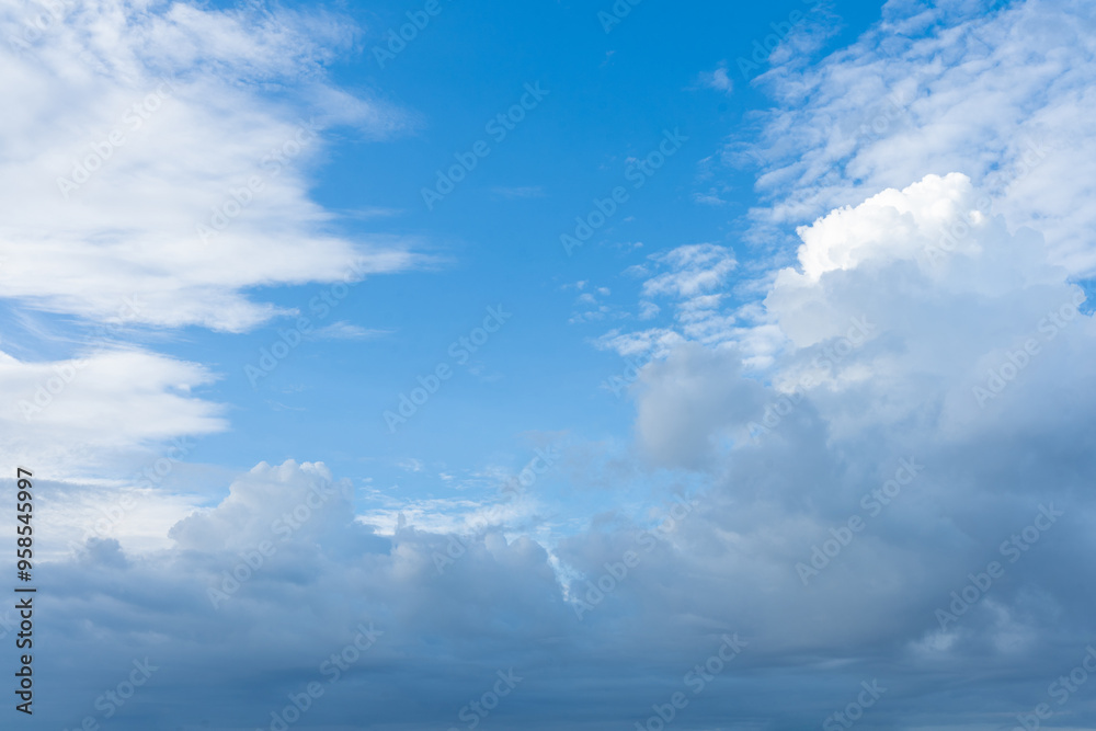 Serene azure canvas adorned with fluffy white clouds Serene azure canvas adorned with fluffy white clouds