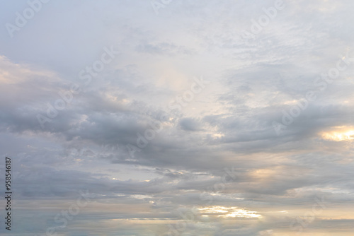 Dramatic cloudscape painted by a sunset, casting long shadows across the landscape