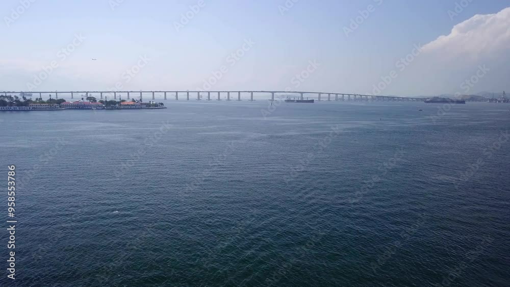 Aerial view of Ponte Rio Niteroi bridge over the water connecting Rio de Janeiro to Niteroi. Aerial view of Ponte Rio Niteroi bridge over the water connecting Rio de Janeiro to Niteroi.
