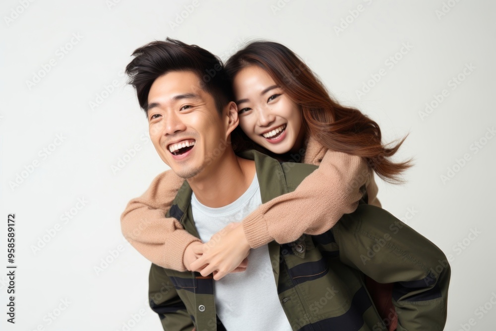 Φωτογραφία Young playful couple piggyback laughing smile adult.
