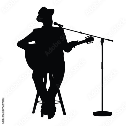 The silhouette of a guitarist sitting on a chair playing guitar while singing