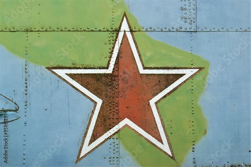 The symbol of the Soviet Union is a red star. A star on the fuselage of an old military helicopter. photo