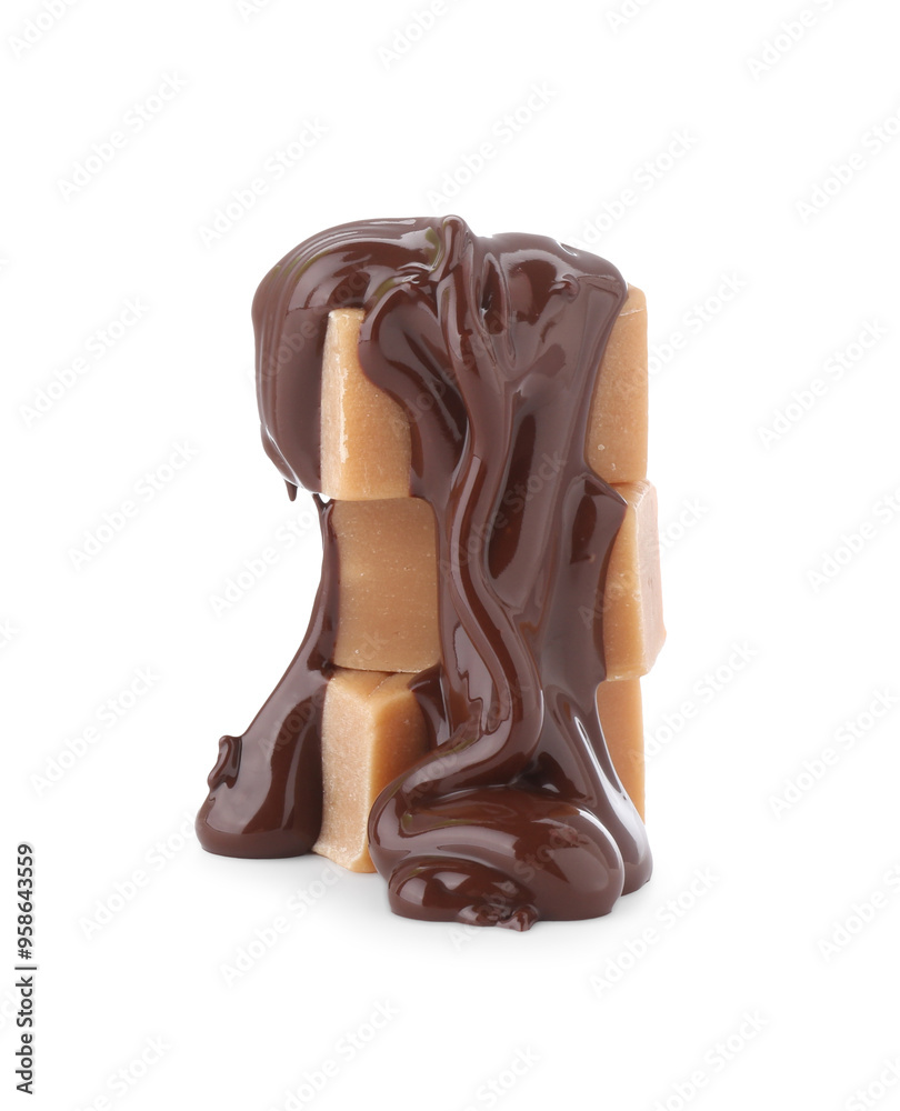 Delicious caramel candies with melted chocolate isolated on white Delicious caramel candies with melted chocolate isolated on white