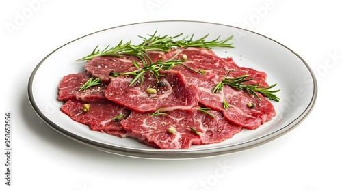 Fresh raw beef slices with rosemary on a plate perfect for culinary inspiration