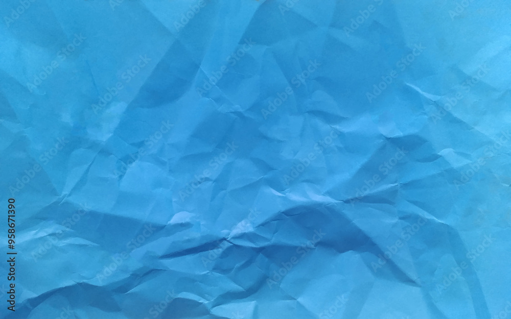 Fototapeta premium Rough crumpled texture surface of retro old vintage classic crumpled paper. Background or backdrop. Design blank. Pure or mostly pure blue