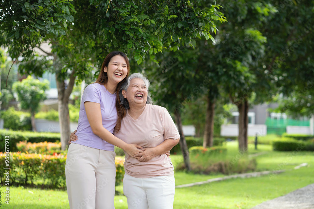 Two women are laughing and hugging in a park. Scene is happy and joyful Two women are laughing and hugging in a park. Scene is happy and joyful
