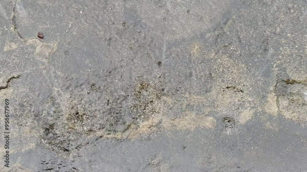 Rainwater falling from the roof of the house splashes on the cement floor Rainwater falling from the roof of the house splashes on the cement floor