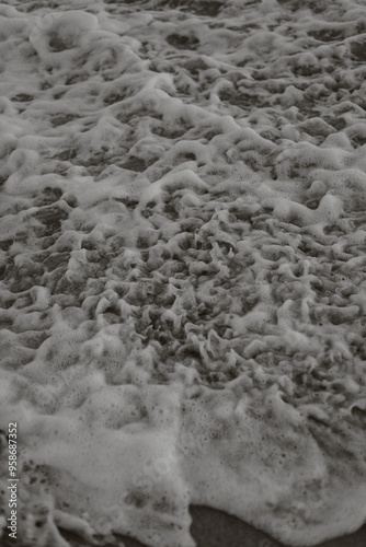 Beach, Sand, Waves. Waves breaking on the beachfront and forming incredible textures