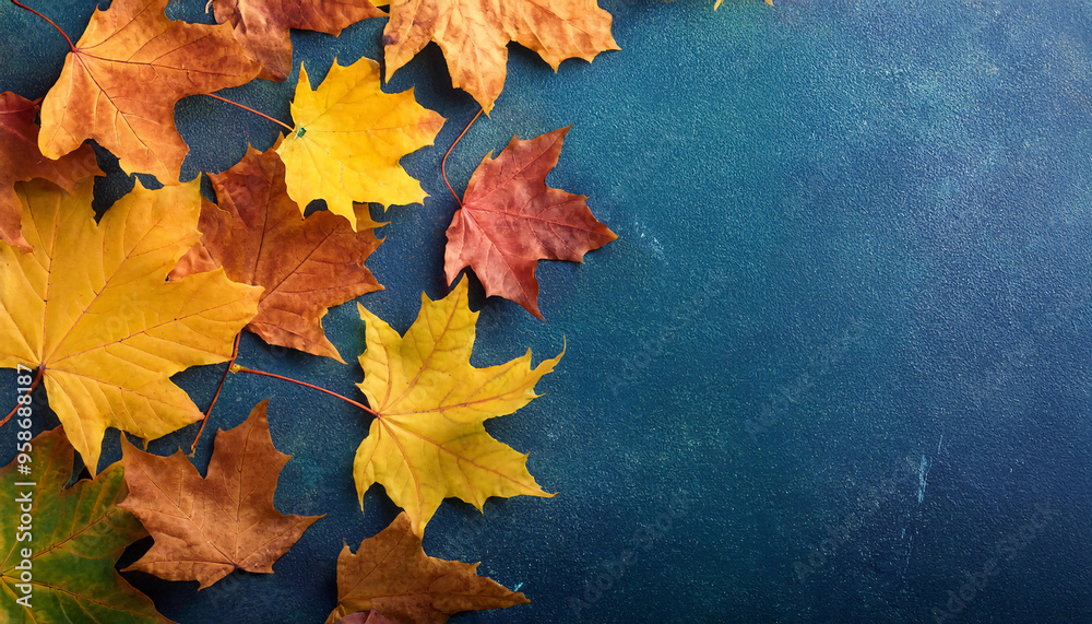 Autumn background with colored leaves on blue slate background Autumn background with colored leaves on blue slate background