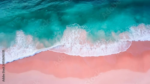 Turquoise ocean water washing pink sand beach shore