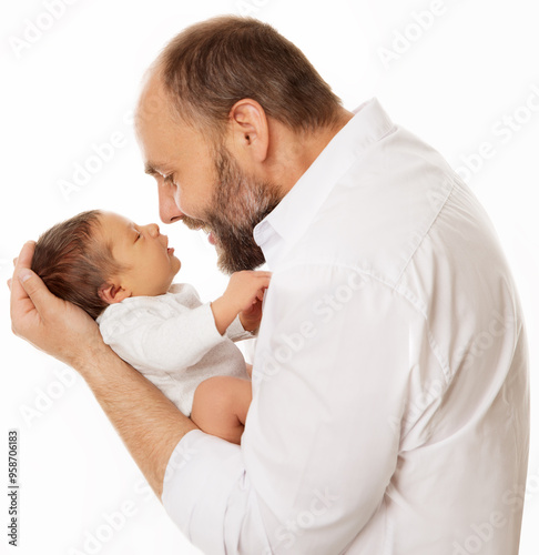 Father with Baby Boy. Happy Dad Face to Face to Newborn Child over White. Smiling Man holding in Hands one Month Infant side view. Kids Health Care and Parenting