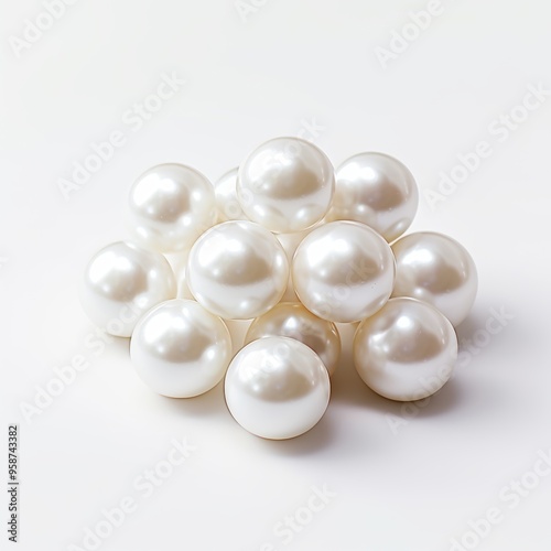 A beautiful pearl is nestled inside a shell on a plain white background