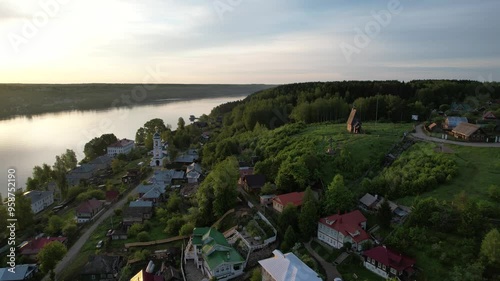 Drone flight over the city of Ples with a view of the Volga River, in spring with beautiful colorful sunrise