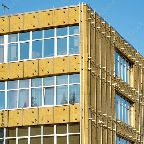 External wall insulation using wool material on building, process of improving energy efficiency and thermal protection through effective insulation techniques. Building preparing for cladding photo