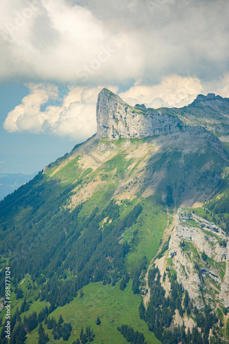 pointed rock in at a mountain ridge with a scree in a national UNESCO park. vacation and travel concept