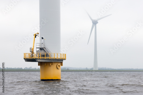 Offshore windfarm near Dutch coast with cloudy sky