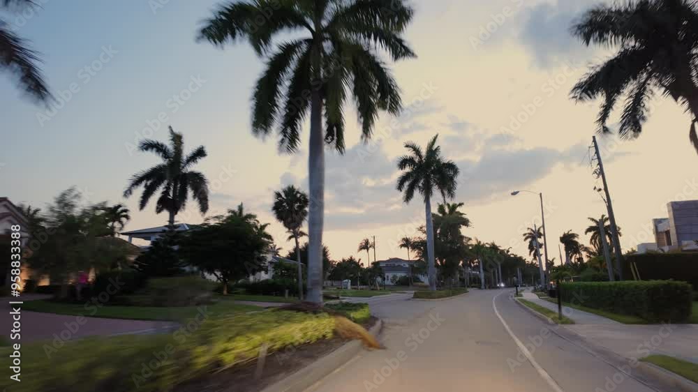 Front POV view car driving on street in Naples Florida on evening time Front POV view car driving on street in Naples Florida on evening time