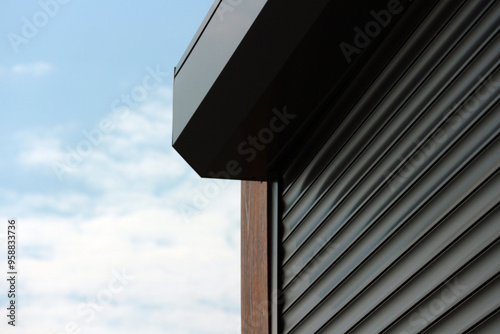 A fragment of the roller doors closing the kiosk.