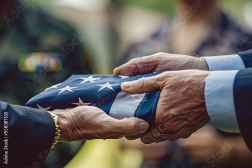 Reverent Hand-Off of a Folded Flag at Military Funeral Ceremony photo