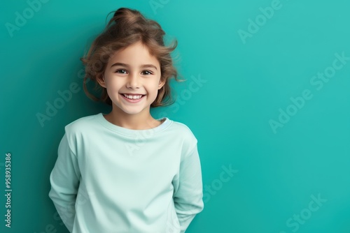 Teal background Happy european white child realistic person portrait of young beautiful Smiling child Isolated on Background Banner with copyspace 