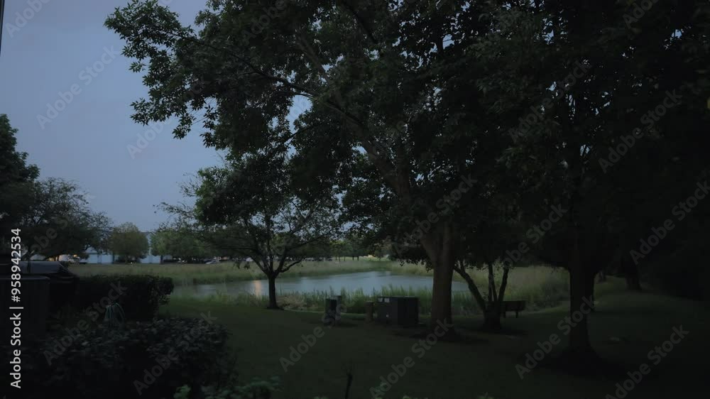 Lightning flashing through tree at evening time. Wide view Lightning flashing through tree at evening time. Wide view