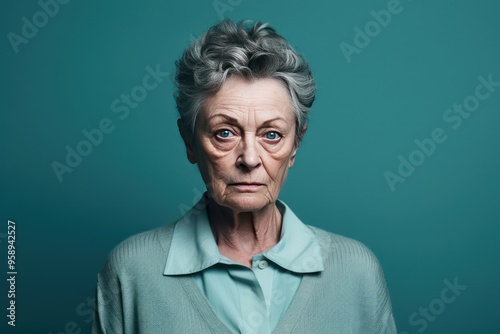 Teal background sad European white Woman grandmother realistic person portrait of young beautiful bad mood expression Woman Isolated Background 