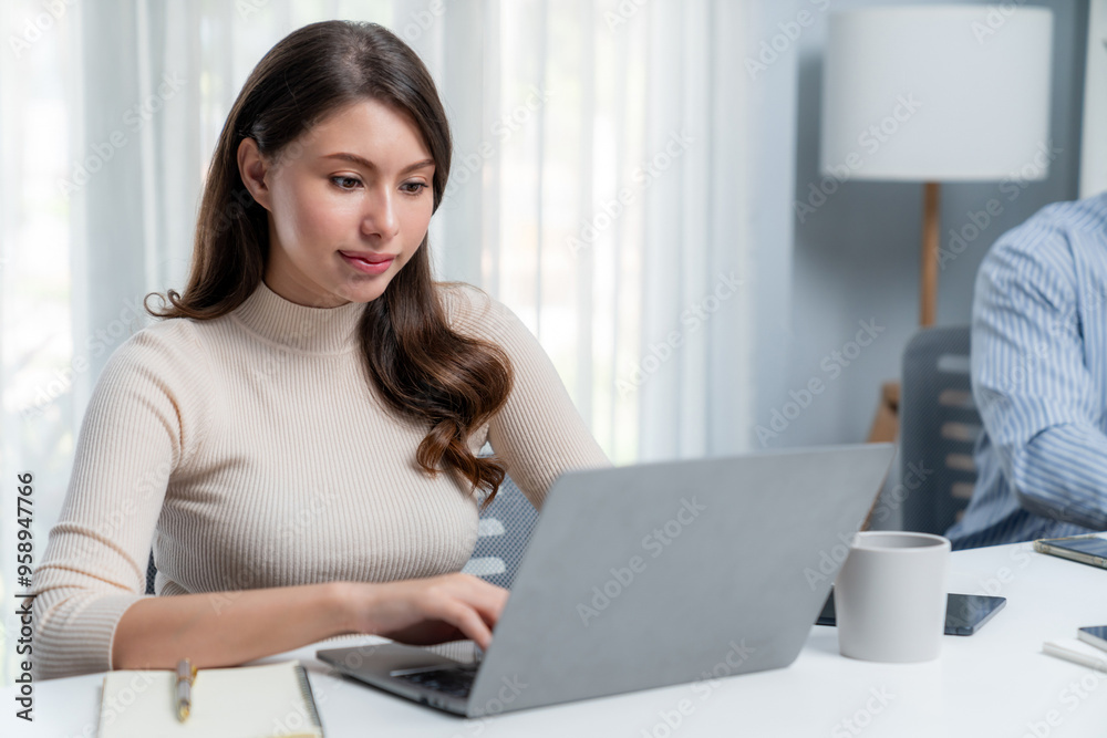 Concentrating beautiful woman typing laptop to analyze with research financial information data report next to smart coworker working computer on desk side view at modern office in morning. Postulate. Concentrating beautiful woman typing laptop to analyze with research financial information data report next to smart coworker working computer on desk side view at modern office in morning. Postulate.