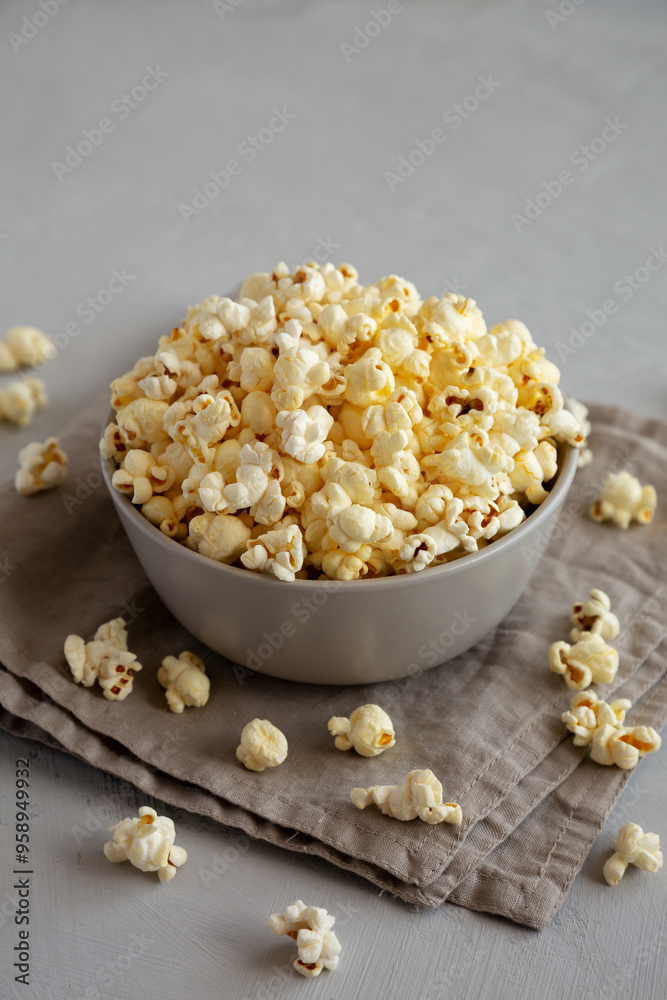 Homemade Salty Popcorn in a Bowl, side view. Homemade Salty Popcorn in a Bowl, side view.