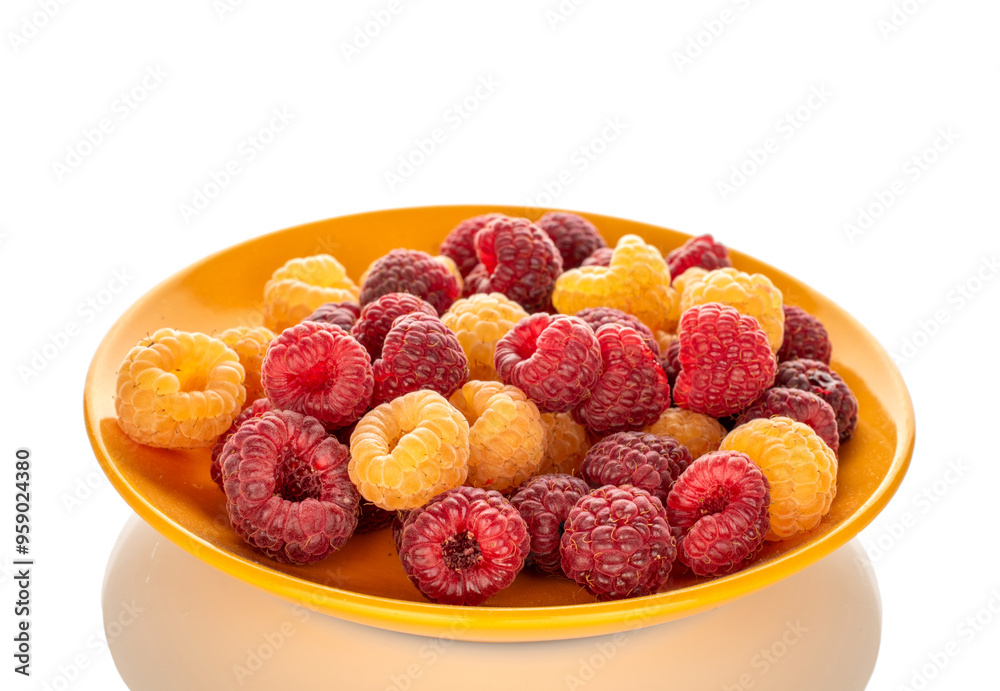 Fresh raspberries on ceramic saucer, macro, isolated on white background. Fresh raspberries on ceramic saucer, macro, isolated on white background.