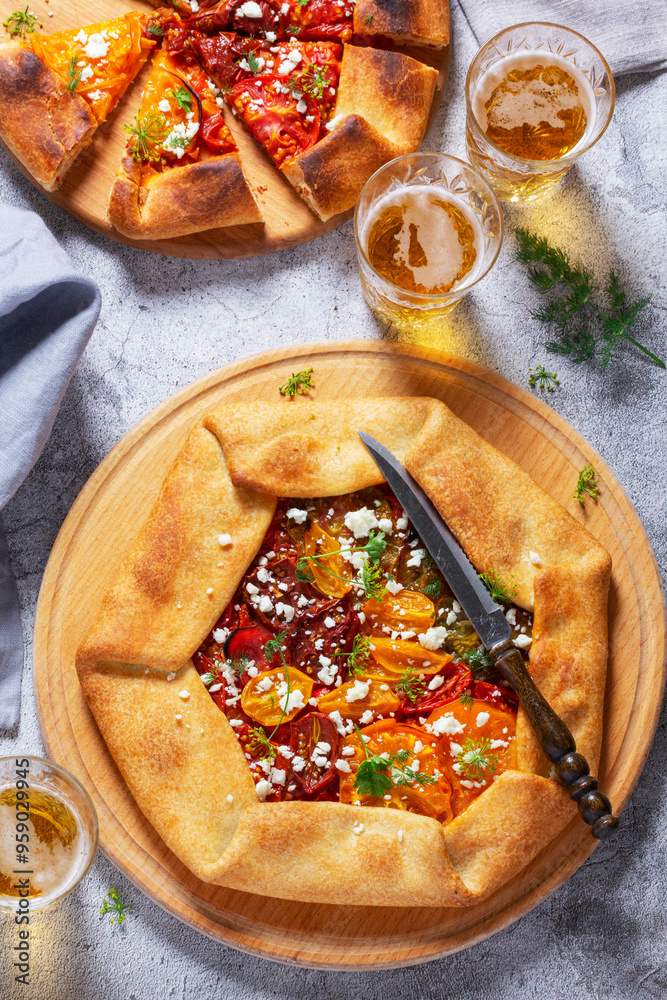 Traditional open pie galette with tomatoes, cheese and herbs, served with beer or wine.