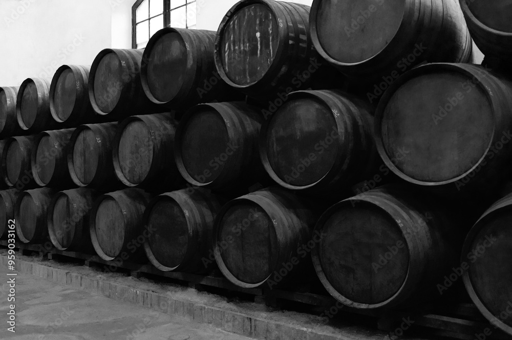 Barrels for whiskey or wine stacked in the cellar. Barrels for whiskey or wine stacked in the cellar.