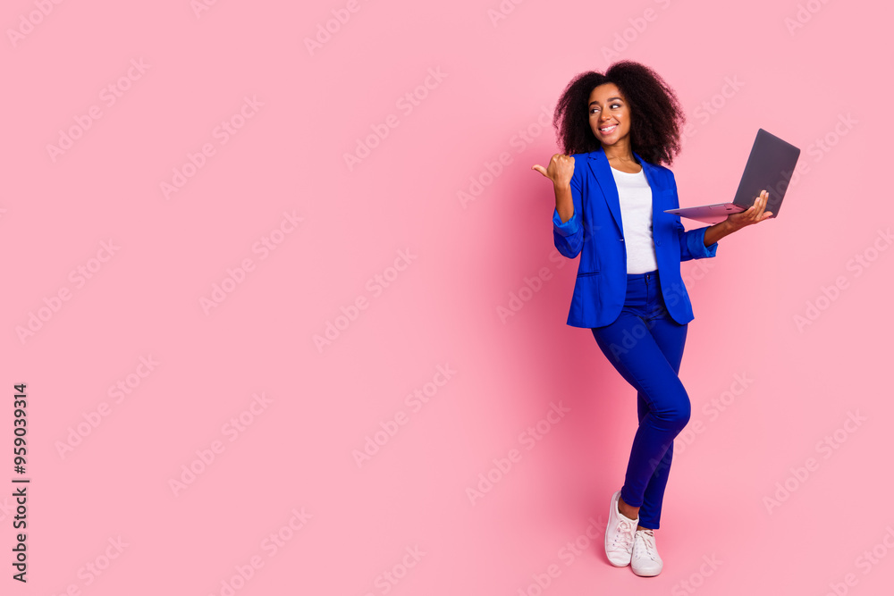 Photo of lovely charming girl wear trendy blue clothes recommend device empty space isolated on pink color background