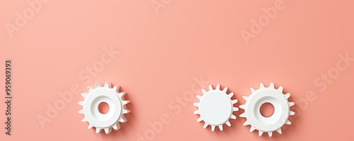 Three white gears on a Coral background, laid flat, copy space concept for business technology and development in the abstract vector with copy space 