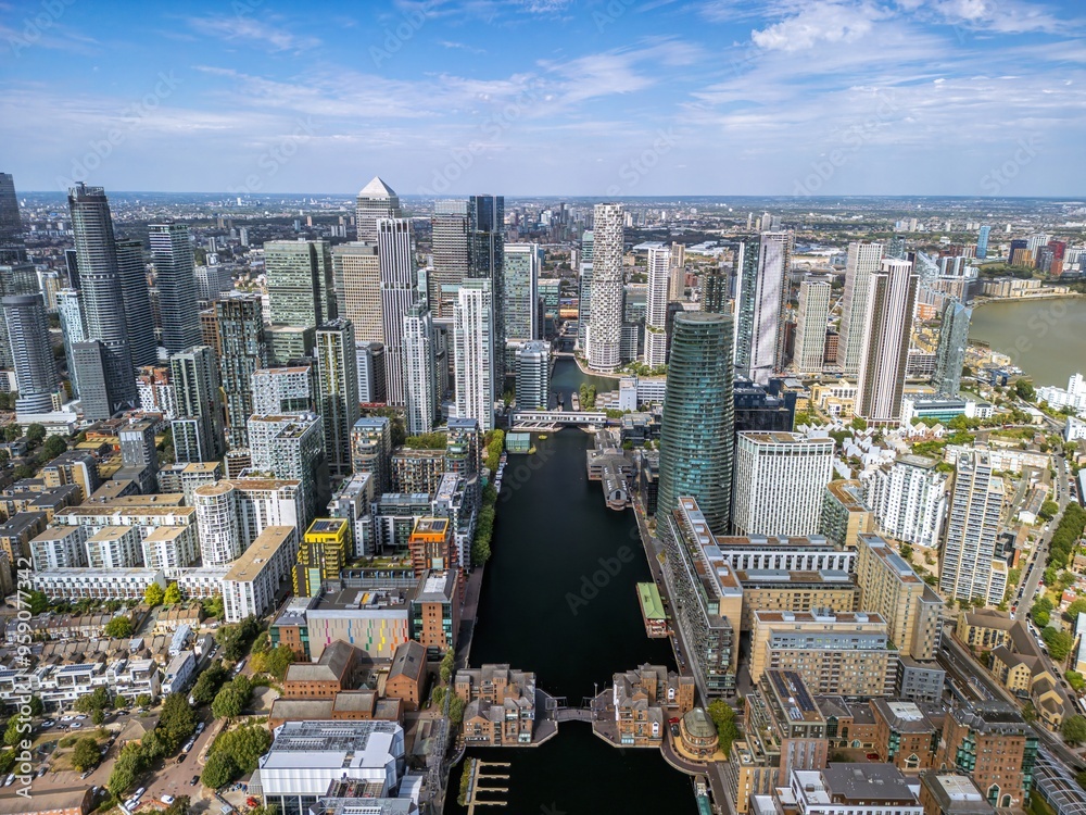 Obraz premium Aerial view of the Canary Wharf business district in London. Panoramia of the skyscrapers in London. Canary Wharf is part of London's central business district.
