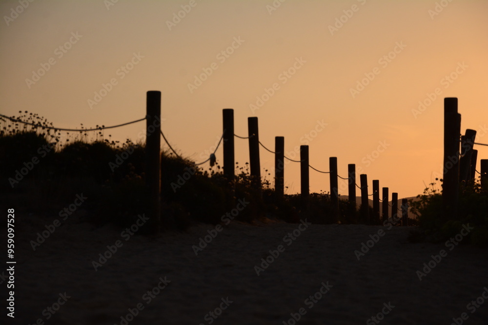 At Porto Pollo in Sardinia, the sunset paints the sky with vibrant orange At Porto Pollo in Sardinia, the sunset paints the sky with vibrant orange
