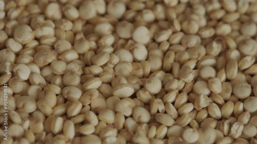 Pile of raw quinoa seeds background rotating macro. Gluten-free eating. Pile of raw quinoa seeds background rotating macro. Gluten-free eating.