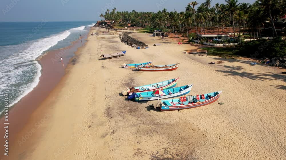 Aerial view of colourful fishing boats on a beach in Varkala, India. Fishermen Working on Beach Aerial view of colourful fishing boats on a beach in Varkala, India. Fishermen Working on Beach