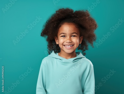 Turquoise background Happy european white child realistic person portrait of young beautiful Smiling child Isolated on Background Banner with copyspace blank