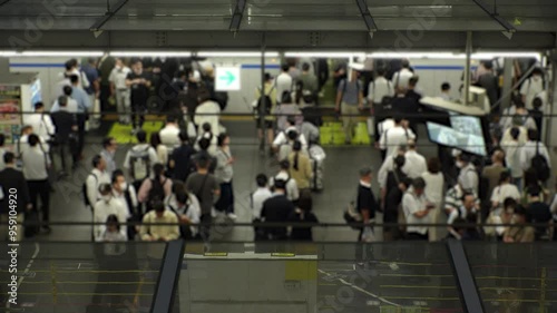 JAPAN : View of crowd of people at the train station in busy night rush hour. Japanese people, commuters and transportation concept video. photo