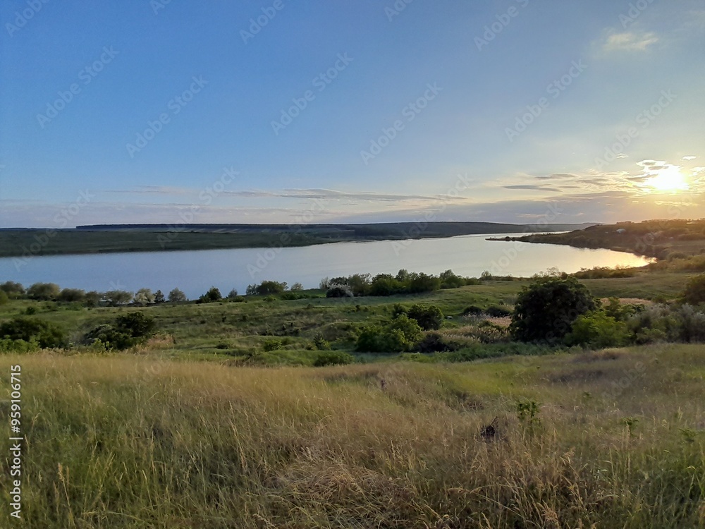 Obraz premium sunset over the river