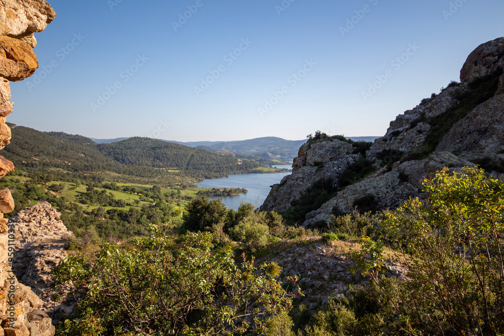 Fototapeta premium View from the mountain to the lake. View from the top of the mountain to the sea and the sky. Panoramic view of the River from the mountain.