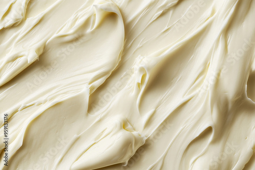 A light buttercream surface with a smooth, glossy texture. The warm, creamy tone and sleek texture add a luxurious and inviting feel to the background. photo