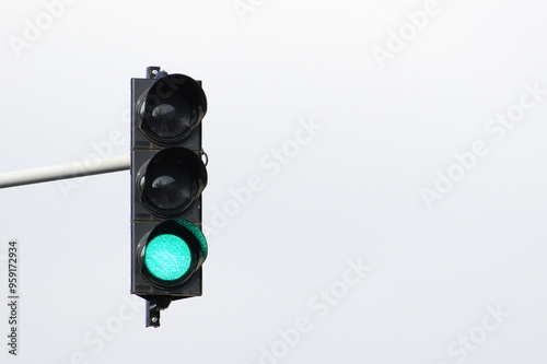 Green light on traffic lights. Isolated on white background. Negative copy space for placement of text.