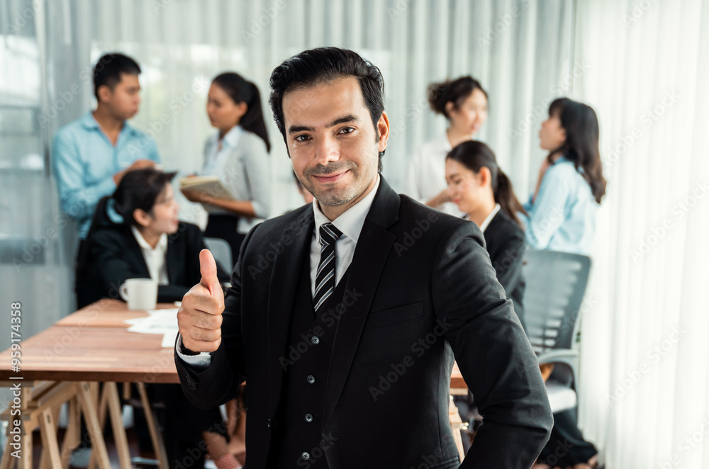 Portrait of happy businessman looking at camera, make approval hand gesture thumb up with motion blur background of business people movement in dynamic business meeting. Habiliment Portrait of happy businessman looking at camera, make approval hand gesture thumb up with motion blur background of business people movement in dynamic business meeting. Habiliment