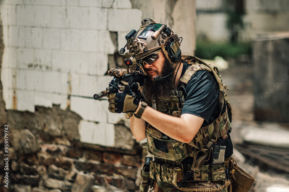 Fototapeta premium Portrait of air soft shooter shooting towards camera from sniper rifle