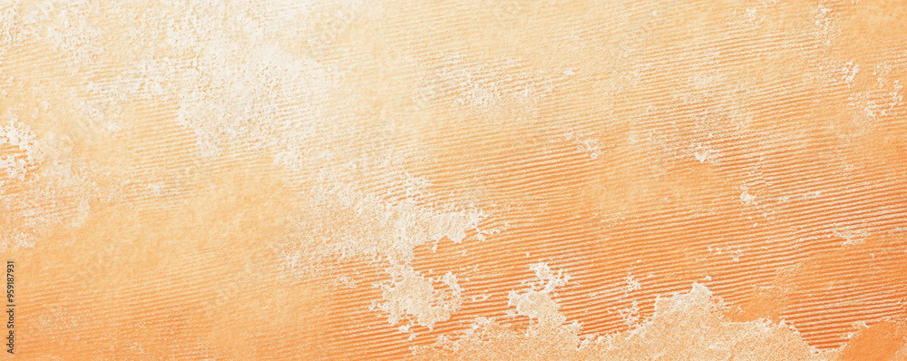 Fototapeta premium A light pastel orange surface with a fine, stippled texture. The warm, cheerful hue and subtle texture add a cozy and inviting feel to the background.