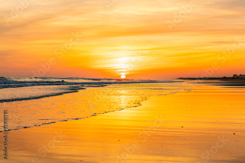 Sunset Serenity: A Tranquil Beach Scene at the Edge of the World