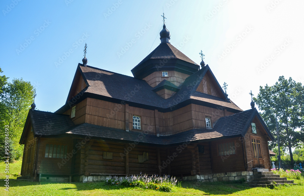 Fototapeta premium Wooden Church of the Nativity of the Blessed Virgin Mary dating in 1719 in Kryvorivnia village is one of the most famous creations of the Hutsul school of folk architecture