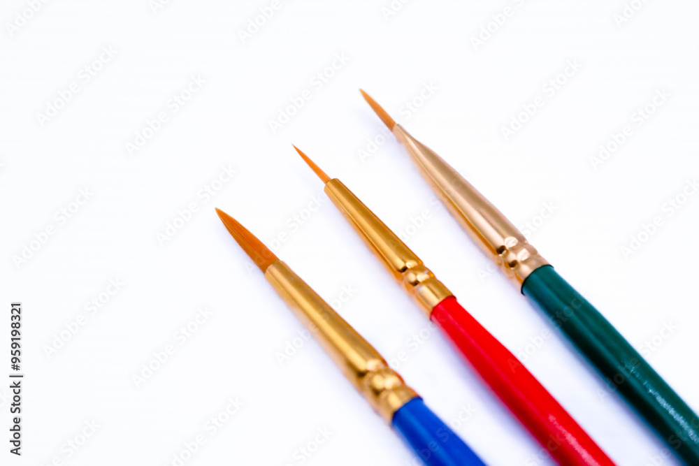 Three brushes on a white background close up Three brushes on a white background close up