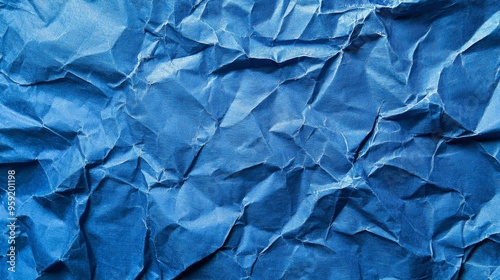 A Stunning Close-Up of Crumpled Blue Paper Texture, Showcasing Intriguing Details and Subtle Variations in Color and Light.